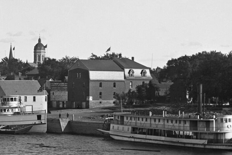 An archival black and white photo shows part of downtown Fredericton in 1905.