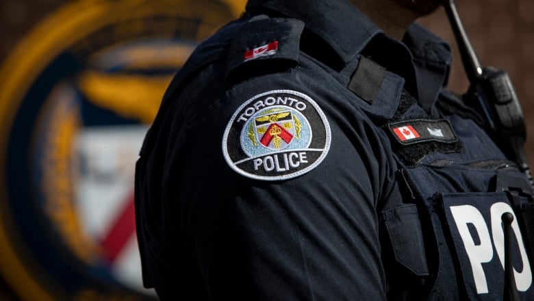 A Toronto police officer, their head is not visible.