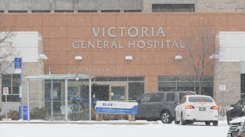 The exterior of a building with a sign reading Victoria General Hospital Main Entrance.