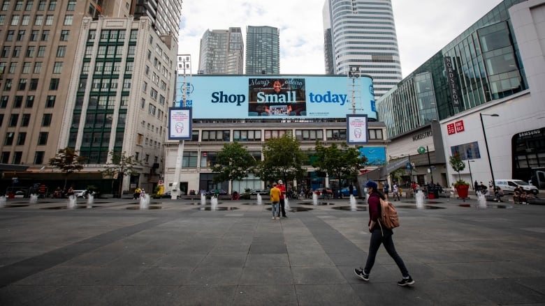 A billboard advertisement by American Express encouraging shoppers to spend locally is on display over Torontos Yonge-Dundas Square on Aug. 4, 2020.