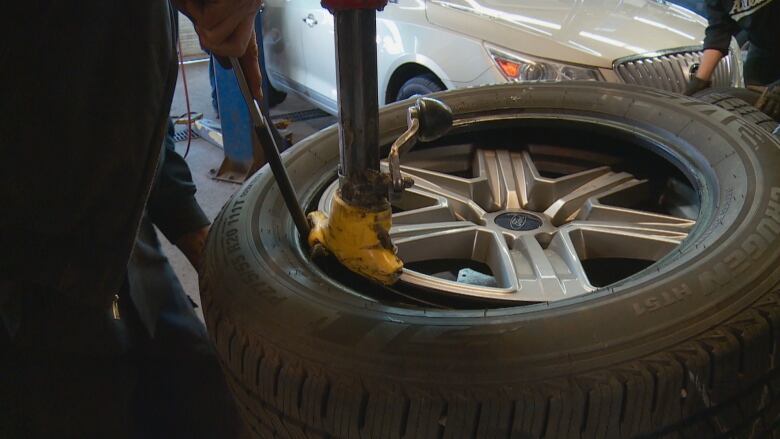 A closeup of a tire in a garage