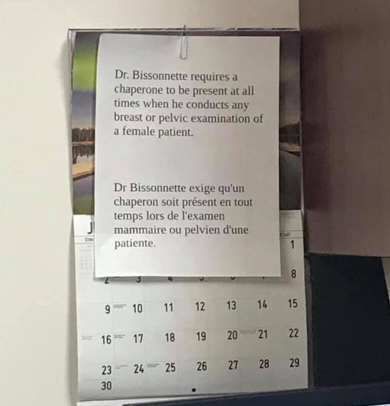 A notice posted on a wall says a doctor requires a chaperone to be present when performing breast or pelvic exams on female patients.