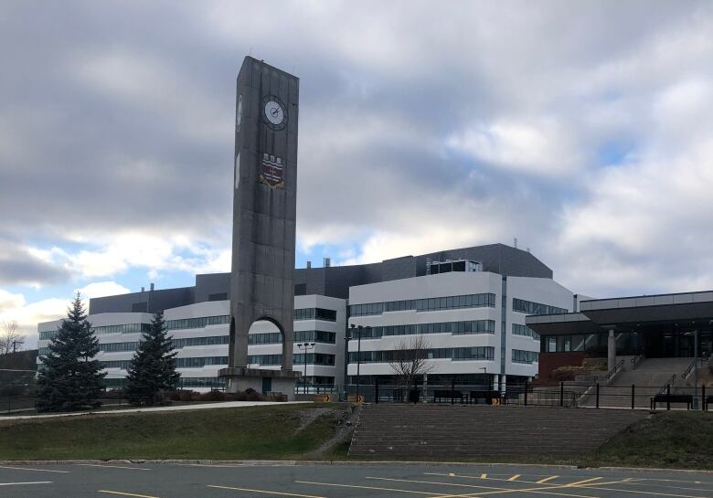 Clock tower and University Centre from the outside on a cloudy day at Memorial University