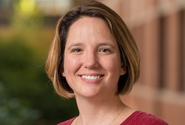 Headshot of a woman with short hair. 