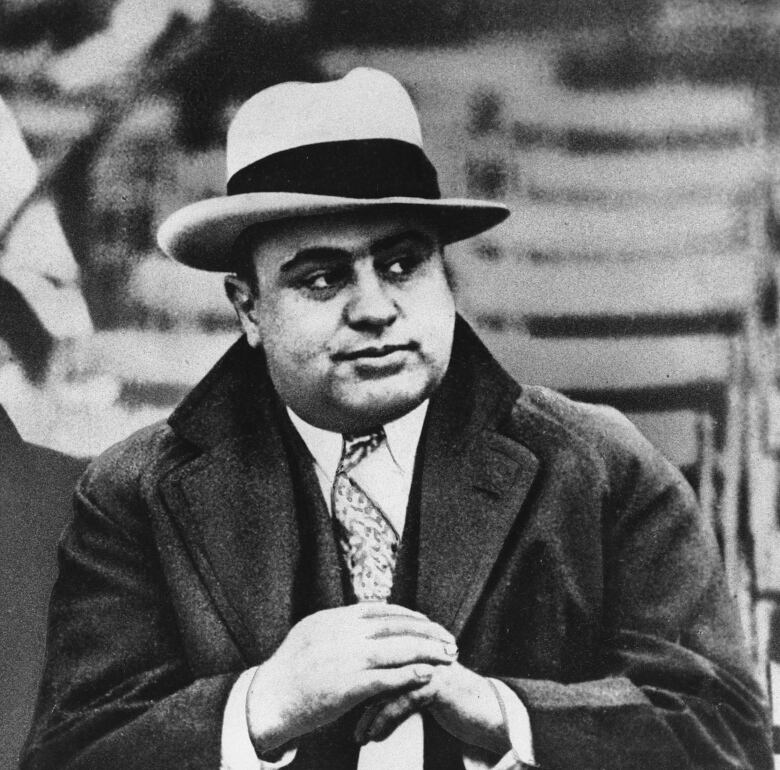 This Jan. 19, 1931, file photo shows Chicago mobster Al Capone at a football game. Capone was sentenced to federal prison for violating income tax laws in October 1931.