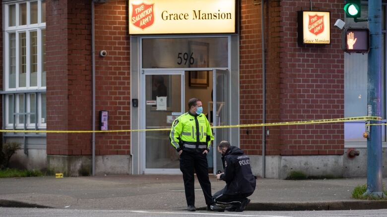 Police are seen outside Grace Mansion on Hastings Street in Vancouver on Jan. 5, 2020.