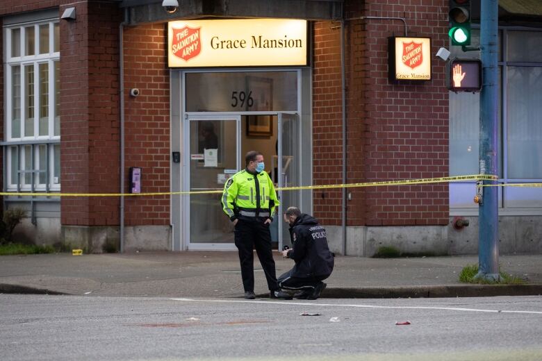 Police are seen outside Grace Mansion on Hastings Street in Vancouver on Jan. 5, 2020.