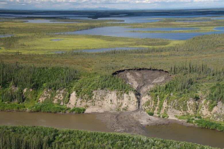 Sinkhole on riverbank.