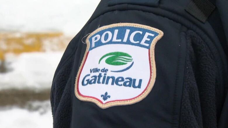 A Gatineau police badge on an officer's sleeve.