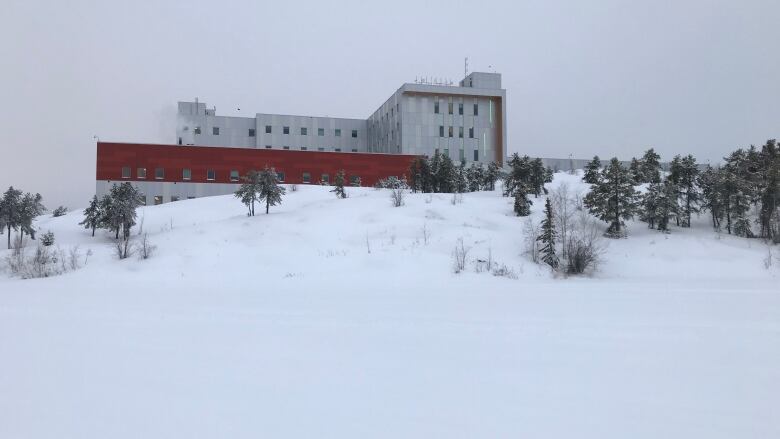 An building against a snowy backdrop.