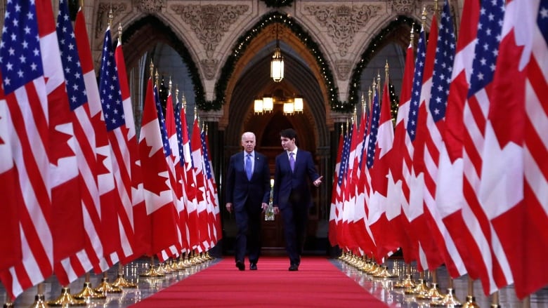 Prime Minister Justin Trudeau and U.S. vice-president Joe Biden walk down the Hall of Honour on Parliament Hill in Ottawa on Friday, December 9, 2016. 