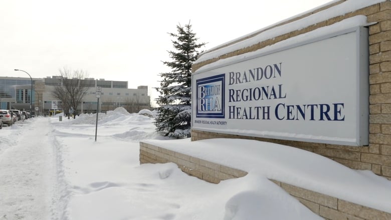 A sign in winter says Brandon Regional Health Centre.