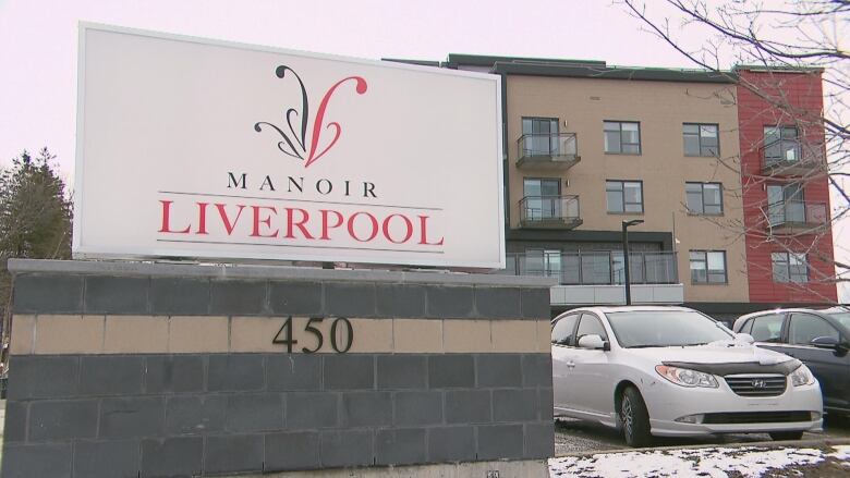 A building with a sign that reads manoir liverpool