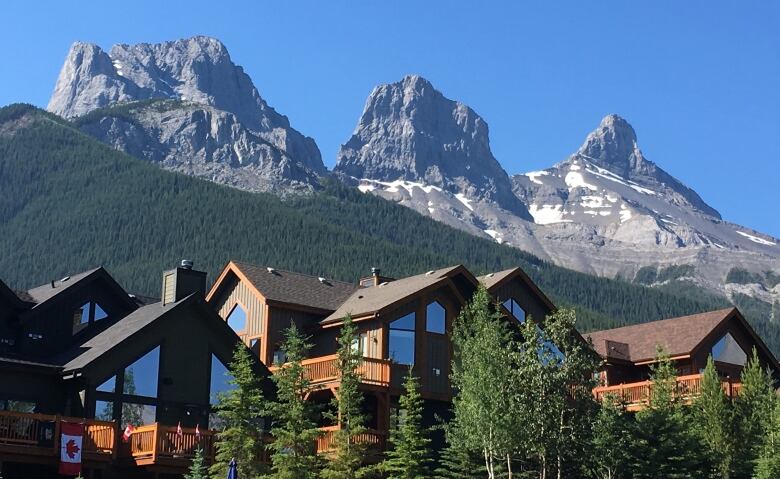 The Three Sisters housing development is shown under the mountain peaks from which it takes its name. 