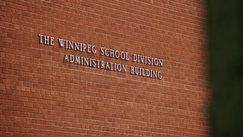 A brick wall with lettering.