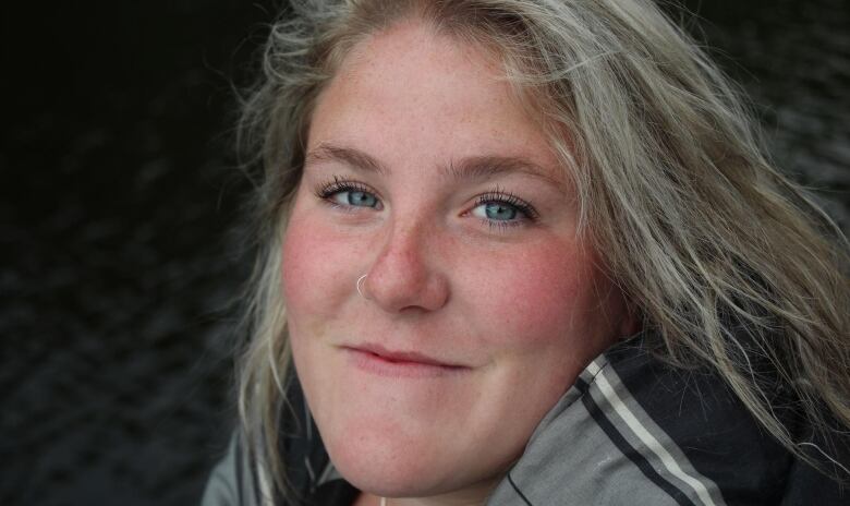 Closeup of a smiling young woman. 