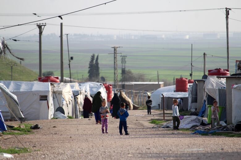 People are seen in a detention camp.