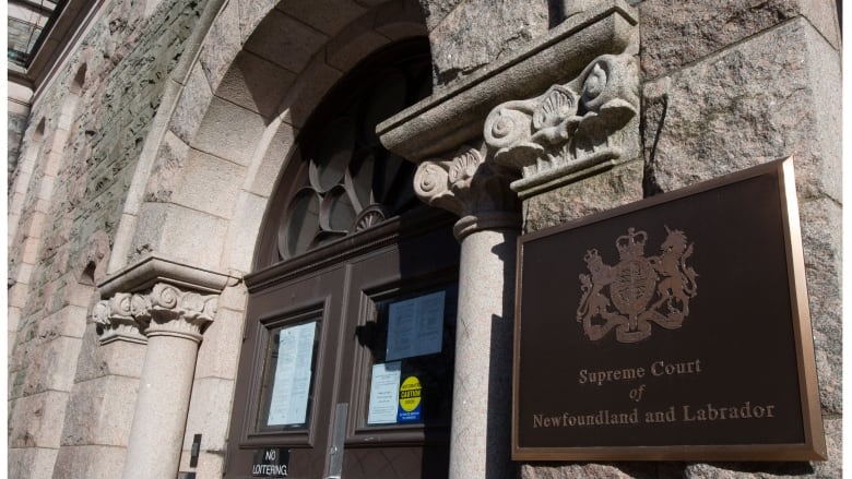 A photo of an old stone building with a sign that reads Supreme Court of Newfoundland and Labrador. 