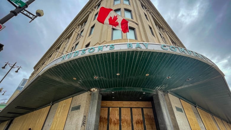 A building with boarded up windows and doors