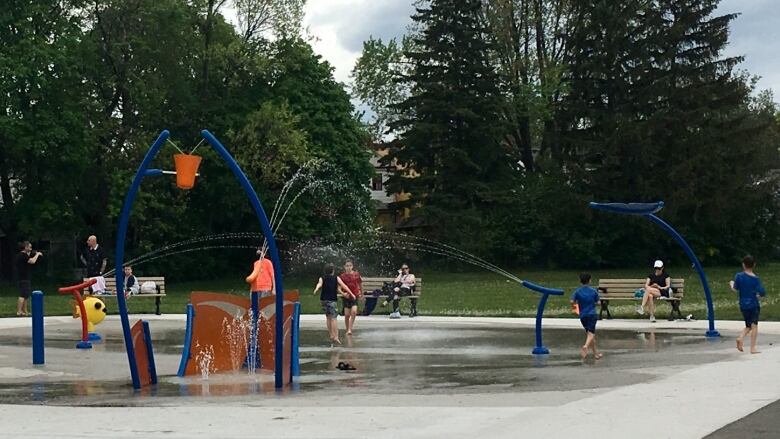 Children play at a splash pad at Clairlea Park in Scarborough.