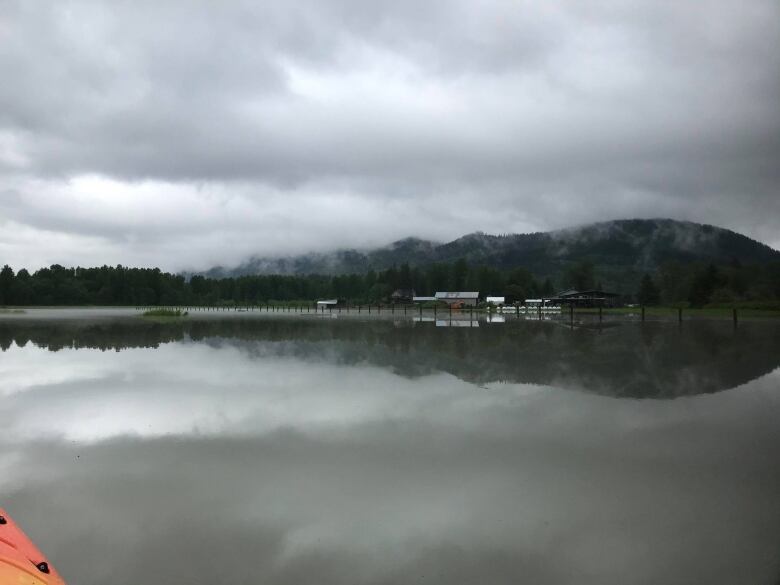 A swath of river water with mountains as background.