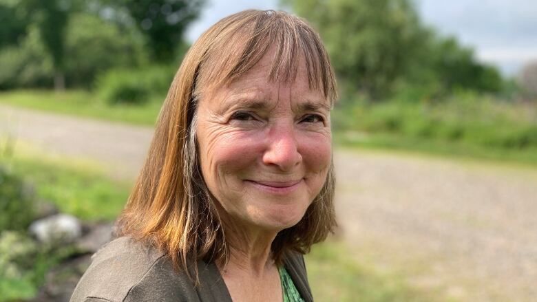 Louise Comeau smiles at the camera.