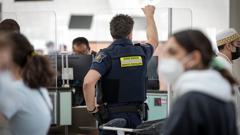 Canada Border Services Agency workers at Pearson International Airport in Toronto.