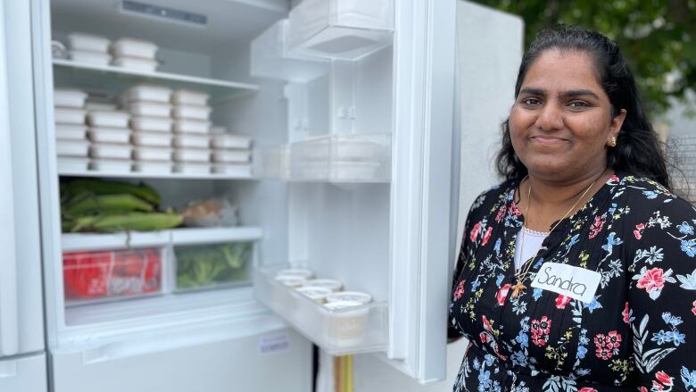 Co-founder Sandra Sunil at the community fridge, which began August 8 and is open 24/7 in Charlottetown. 