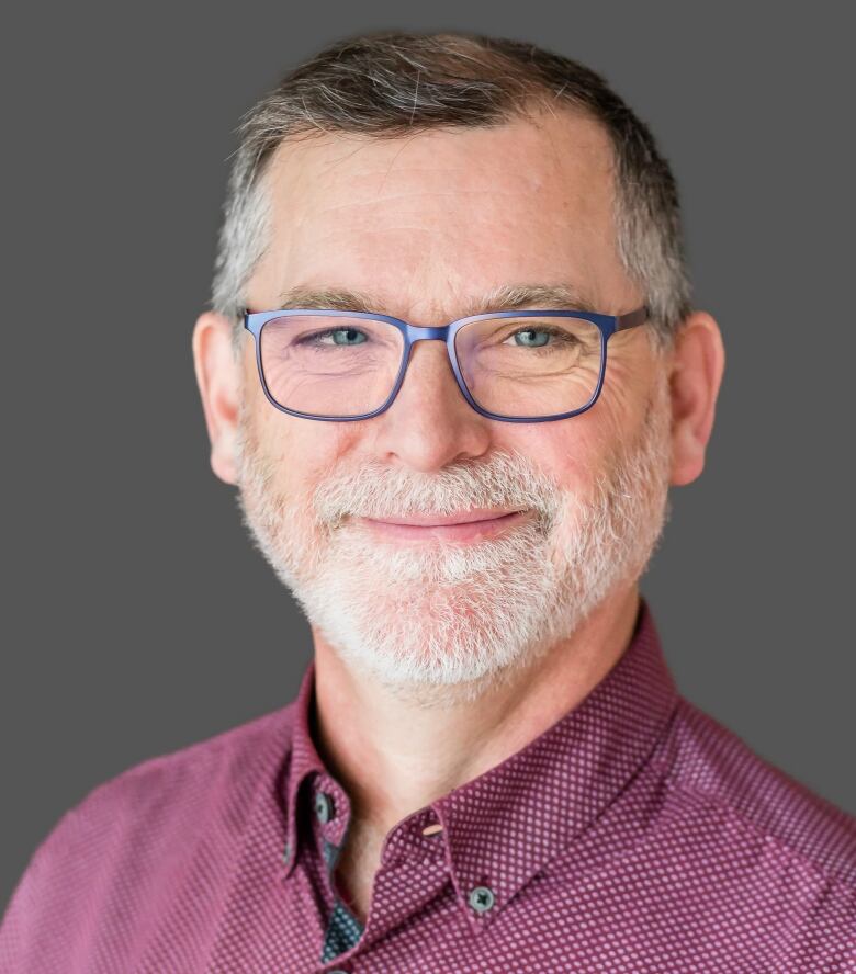 Athabasca University labour relations Prof. Jason Foster is pictured in a headshot.