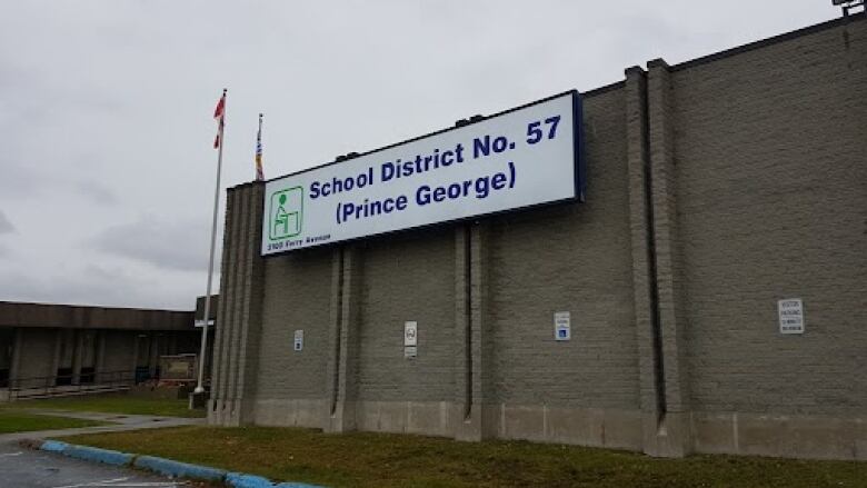 A white sign on a tall building that reads 'School District No. 57 (Prince George)'.