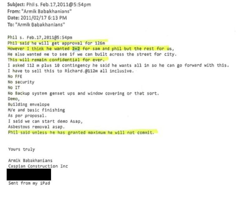 A photo shows an email, with some text highlighted in yellow and some blacked out.