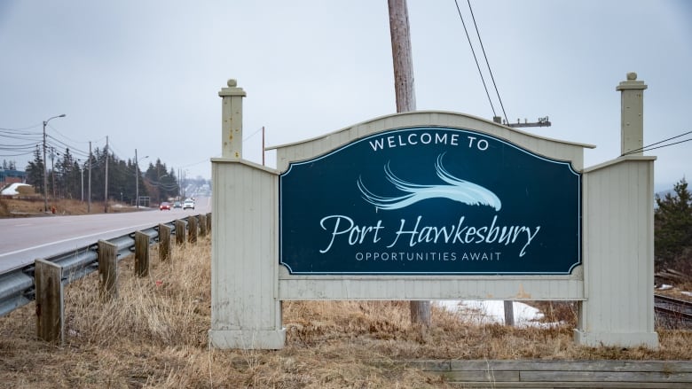 A blue sign for the town of Port Hawkesbury. Opportunites await is written below the twon's name. 