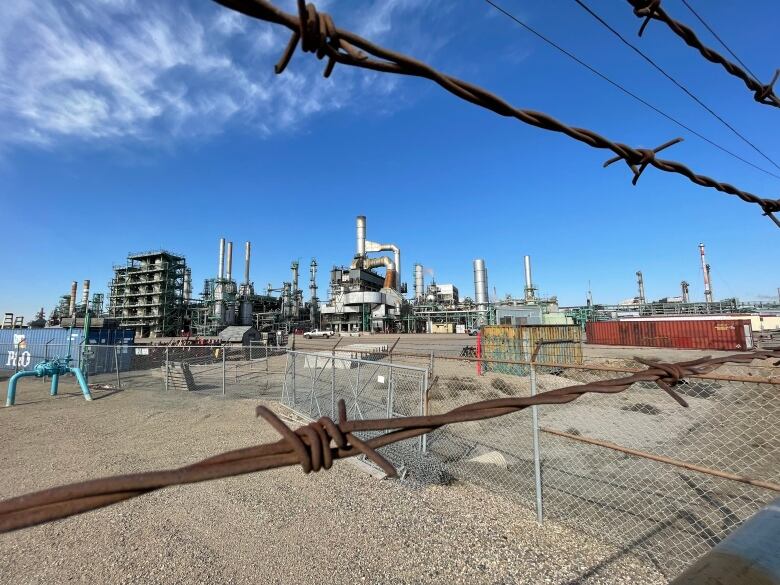 Fence at a refinery complex. 