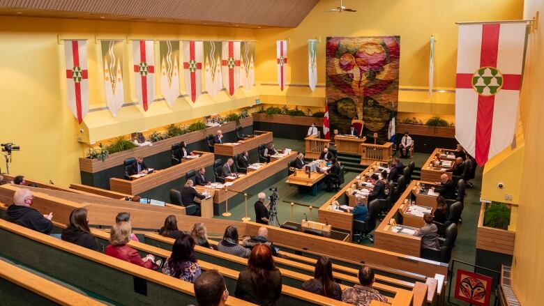 People sit in the chamber of the Yukon Legislative Assembly.