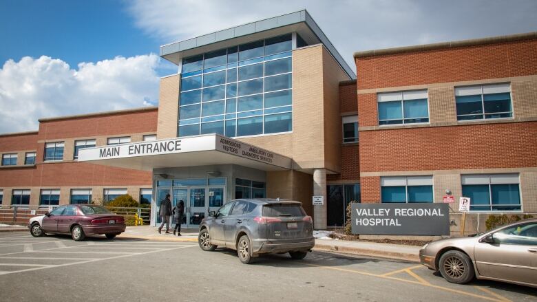 an exterior view of a hospital on a clear day.