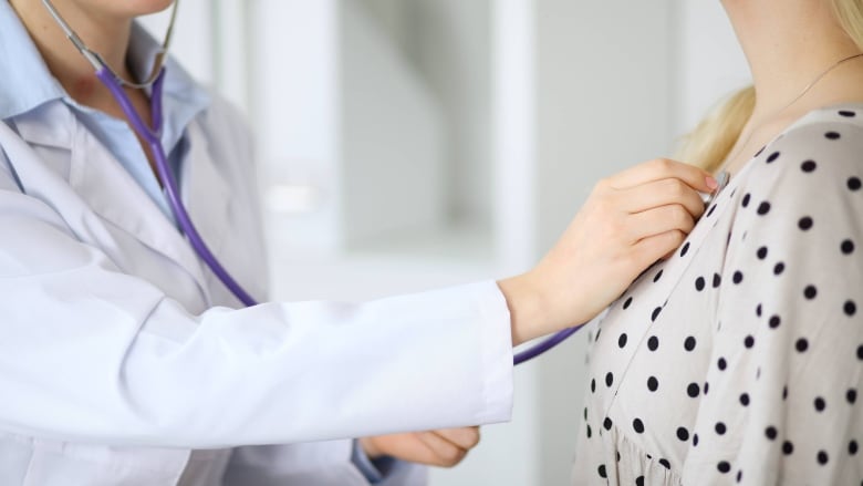 A doctor examining a patient.