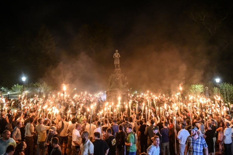 White nationalists participate in a torch-lit march on the grounds of the University of Virginia ahead of the Unite the Right Rally in Charlottesville, Virginia on August 11, 2017.