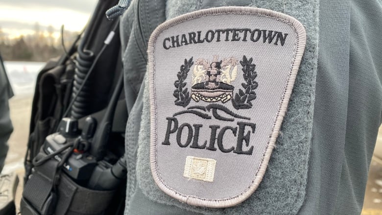 Badge on sleeve of uniform says Charlottetown Police.