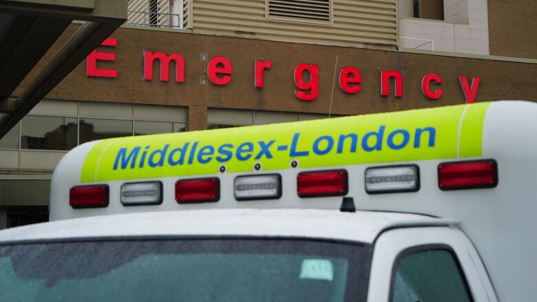 An ambulance is parked outside the emergency department at the Victoria campus of the London Health Sciences Centre. The hospital has seen a sudden surge of COVID-19 patients thanks to the fast-spreading Omicron virus. 