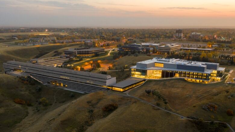 The exterior of a school is seen, from the sky.