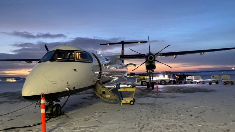 A plane sits on tarmack.