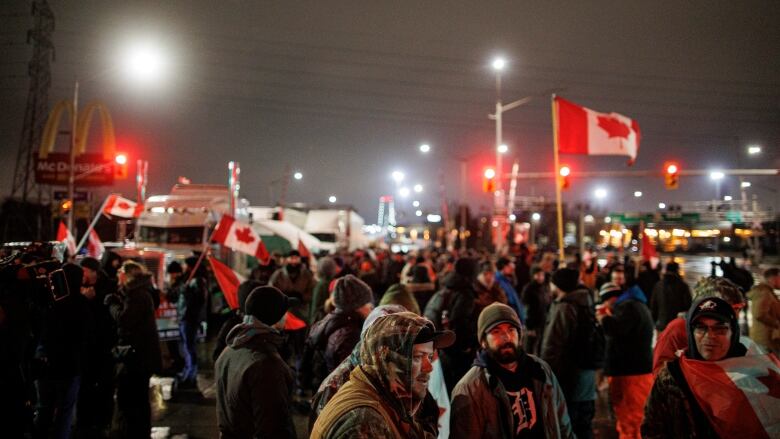 Protests at night of Ambassador Bridge blockade