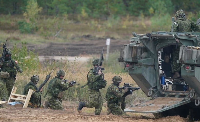 Canadian soldiers take part in NATO military exercises at a training ground in Kadaga, Latvia, on Sept. 13, 2021. NATO responded to Russia's 2014 annexation of Crimea by bolstering its forces near Russia and conducting drills on the territory of its Baltic members  manoeuvres the Kremlin has described as a security threat.