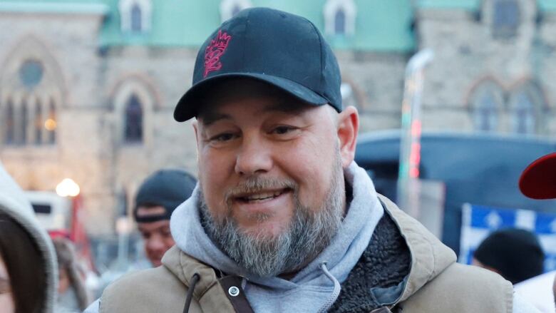 Pat King, one of the organizers of the protest, poses for photos in front of Parliament Hill as truckers and their supporters continue to protest against coronavirus disease (COVID-19) vaccine mandates in Ottawa, Ontario, Canada, Feb. 16, 2022. 