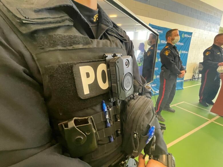 Close up image of a police officer's uniform with a camera mounted at chest level.