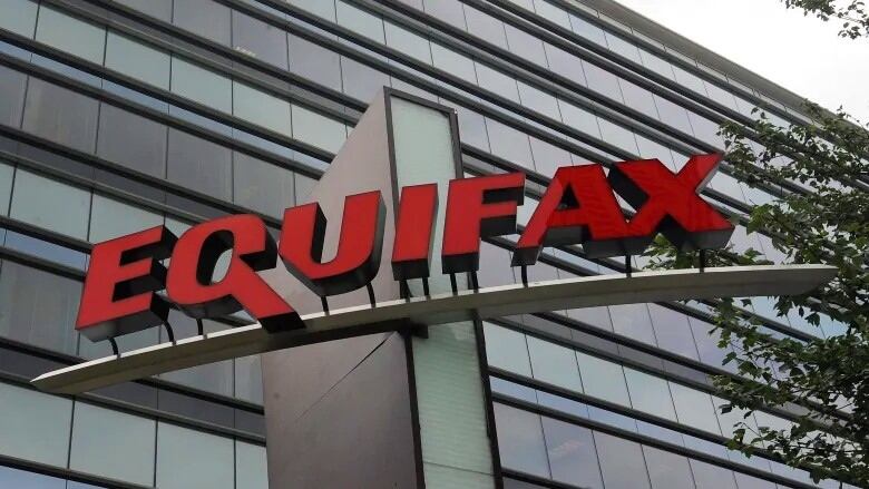 The Equifax sign is shown on a building.