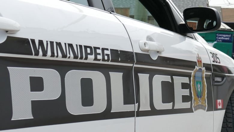 A close up photo of a the text on a Winnipeg police car.