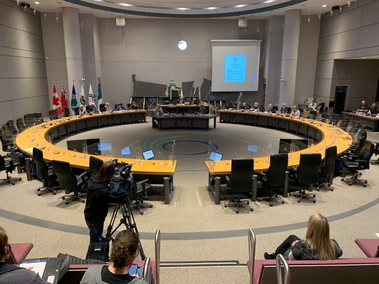 A large room with a large circular table.