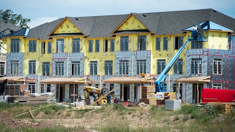 Exterior shot of townhomes under construction