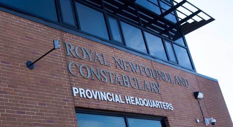 A red brick building with the words Royal Newfoundland Constabulary, provincial headquarters on a sign. 